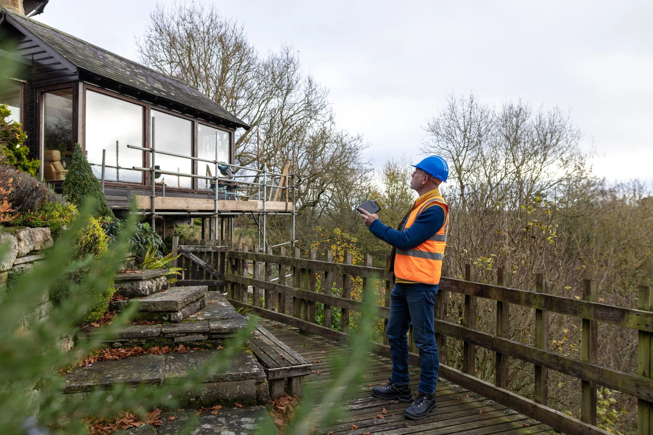 Property inspection professional surveying a home