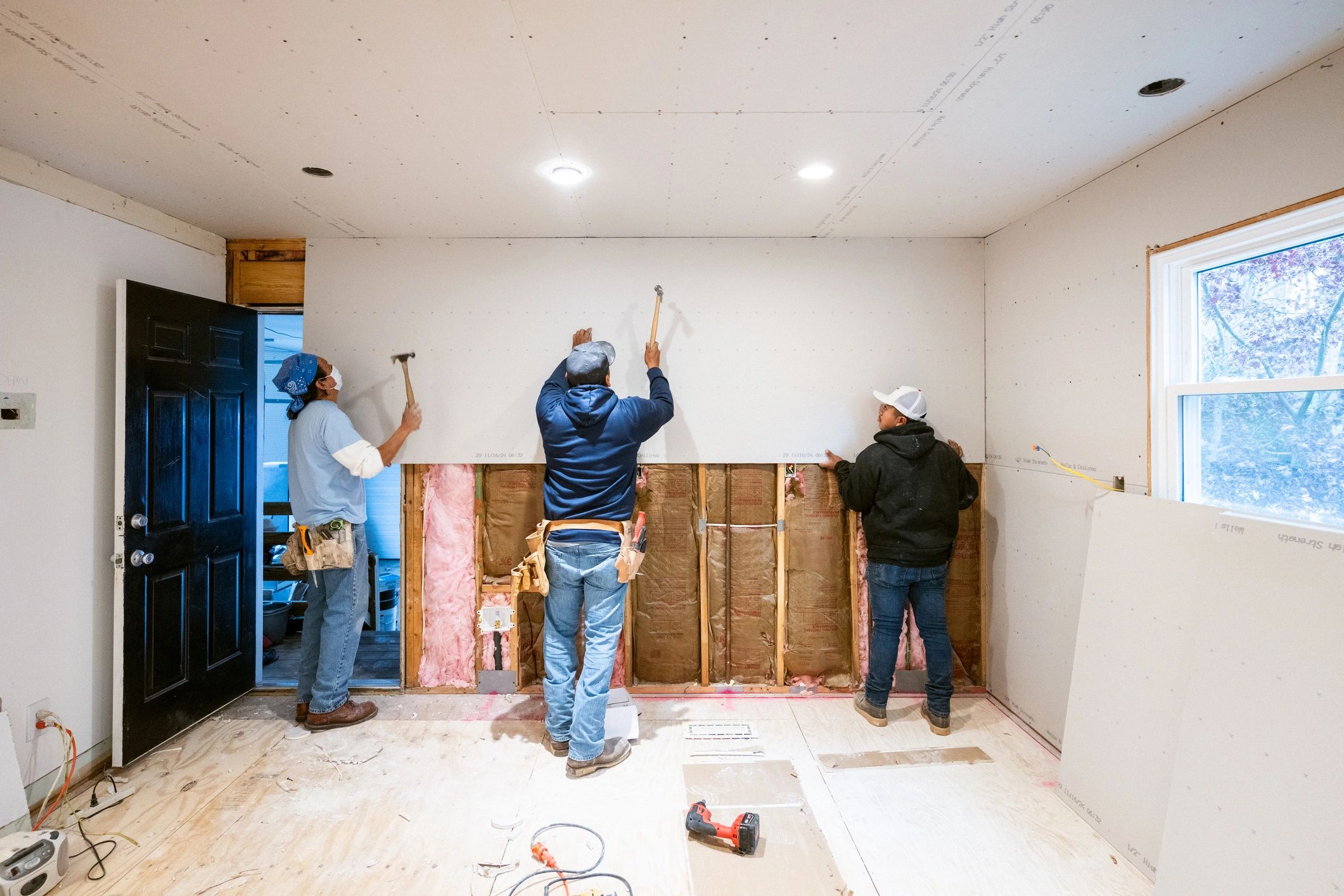 Home repair team working together during a kitchen renovation
